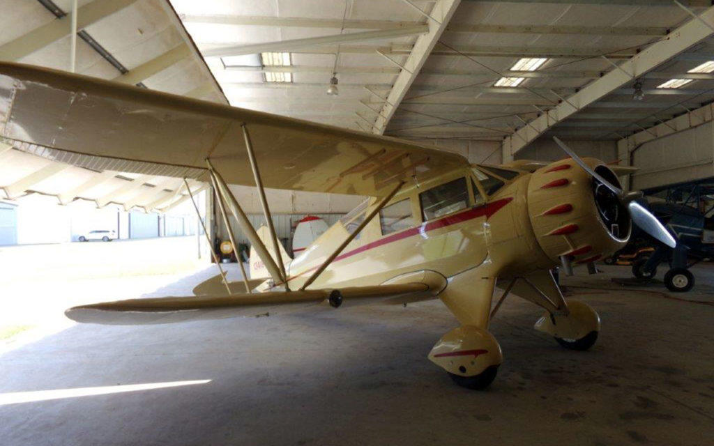 Waco biplane in a hanger